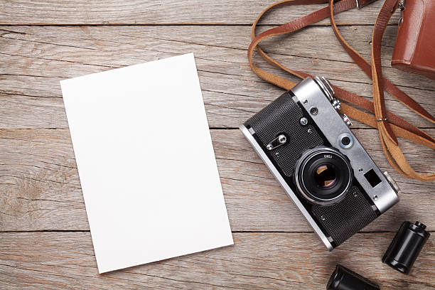 istock Vintage film camera and blank photo frame 487035646