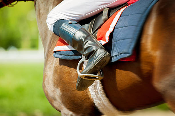 istock runing  thoroughbred race horse with jokey 487035892
