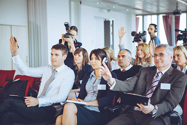 Conference. Group of business people attending press conference or presentation. press room stock pictures, royalty-free photos & images