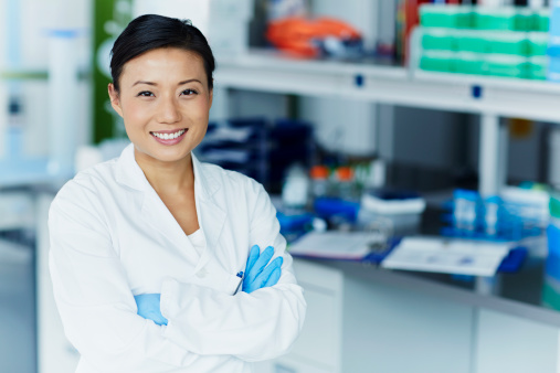 Portrait of confident female scientist in modern laboratory