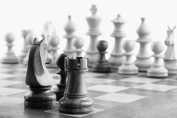 istock Close-up of chess pieces on a chessboard 487041740