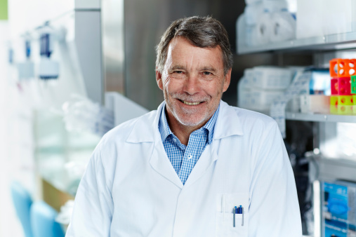 Portrait of smiling male scientist in modern laboratory