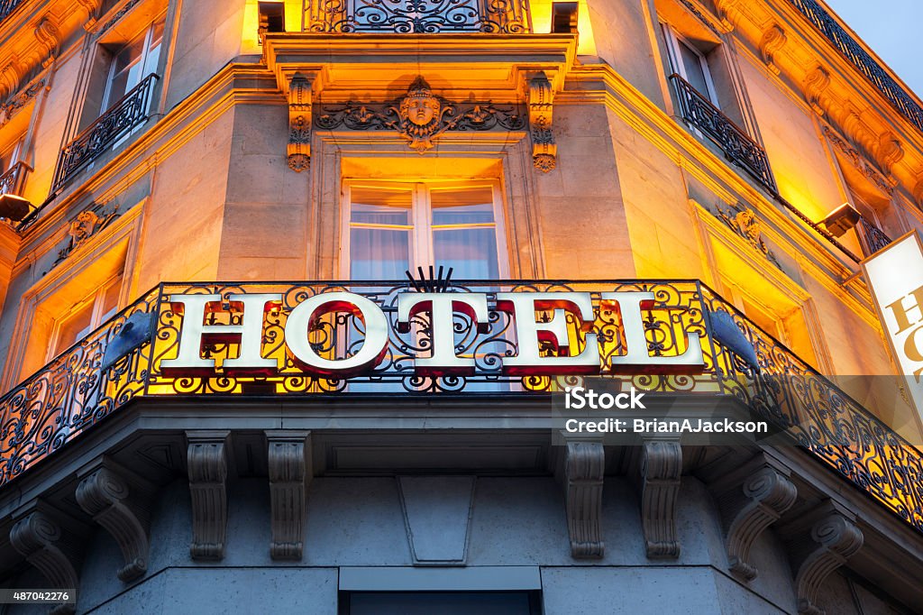 Hotel sign Illuminated hotel sign taken in Paris at night Hotel Stock Photo