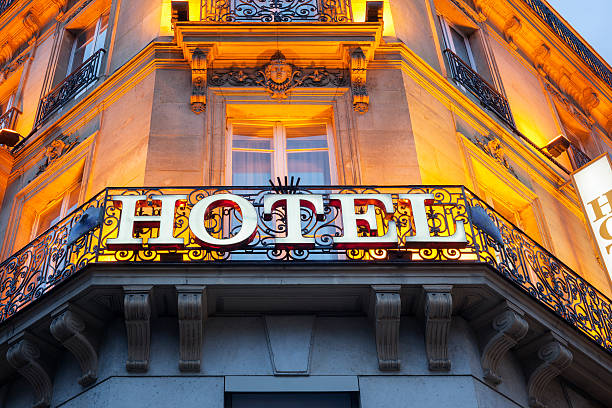 Hotel sign Illuminated hotel sign taken in Paris at night city break photos stock pictures, royalty-free photos & images