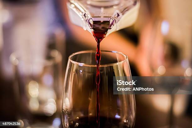 Pouring Red Red Wine Stock Photo - Download Image Now - 2015, Close-up, Defocused