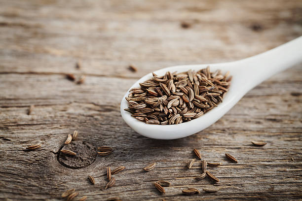 istock Cumin seeds or caraway in white spoon 487045124