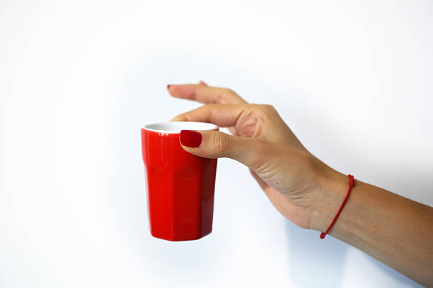 istock Woman Hold Red Glass Isolated On White 487045622