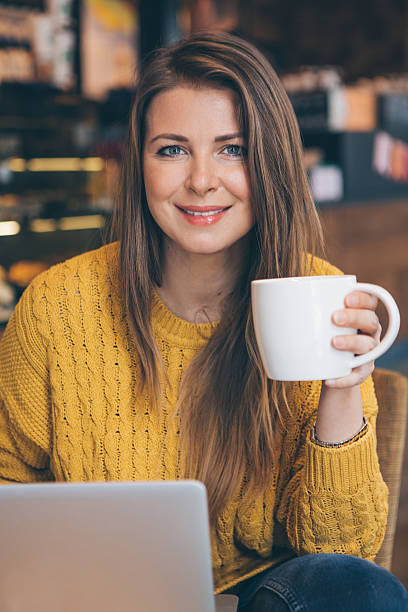 istock Woman with laptop at cafe. 487046268