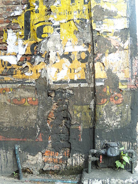 istock Vintage brick wall texture with damaged plaster and drainpipe 487046599