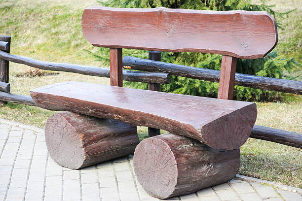 istock wooden bench in park 487048901