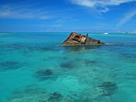 One end of a ship wreck (the Vixen) coming out of a tropical Sea - Square