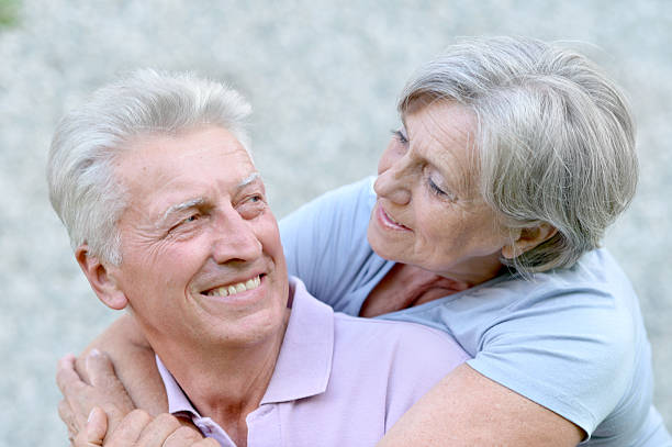 istock Elderly couple in park 487049840