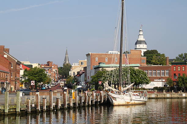 Ego Alley, Annapolis, Maryland Annapolis, Maryland, USA-- August 9, 2012:  Annapolis Harbor as seen from a boat in "Ego Alley", looking up Main Street with the Maryland State House and St. Anne's Church visible. skipjack stock pictures, royalty-free photos & images