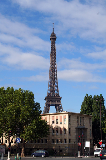 Paris, France - August 4, 2006: The Eiffel Tower (La Tour Eiffel) in Paris. Erected in 1889 as the entrance arch to the 1889 World's Fair, it has become both a global cultural icon of France and one of the most recognizable structures in the world.