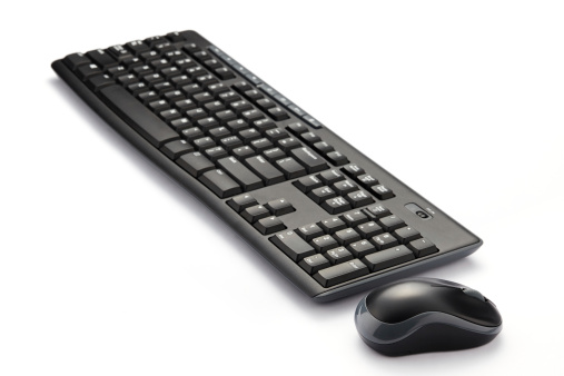 Computer keyboard and mouse isolated on white
