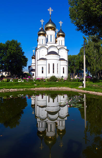 istock white steeple church with three domes 487052363