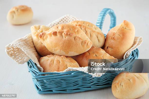 Baked Patties In A Blue Basket Stock Photo - Download Image Now - Baked, Basket, Blue