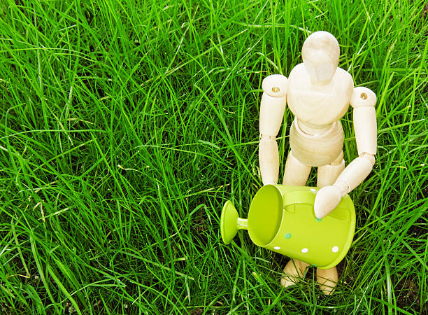 istock Figure of a man watering the lawn 487053583