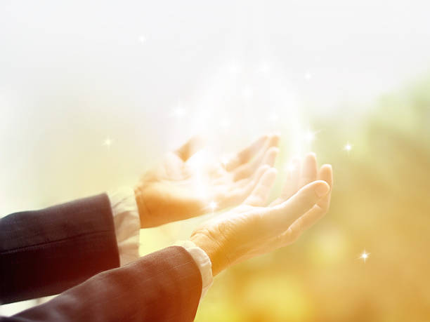 istock Healing Circle of Light, Old female healer with hands open 487054592