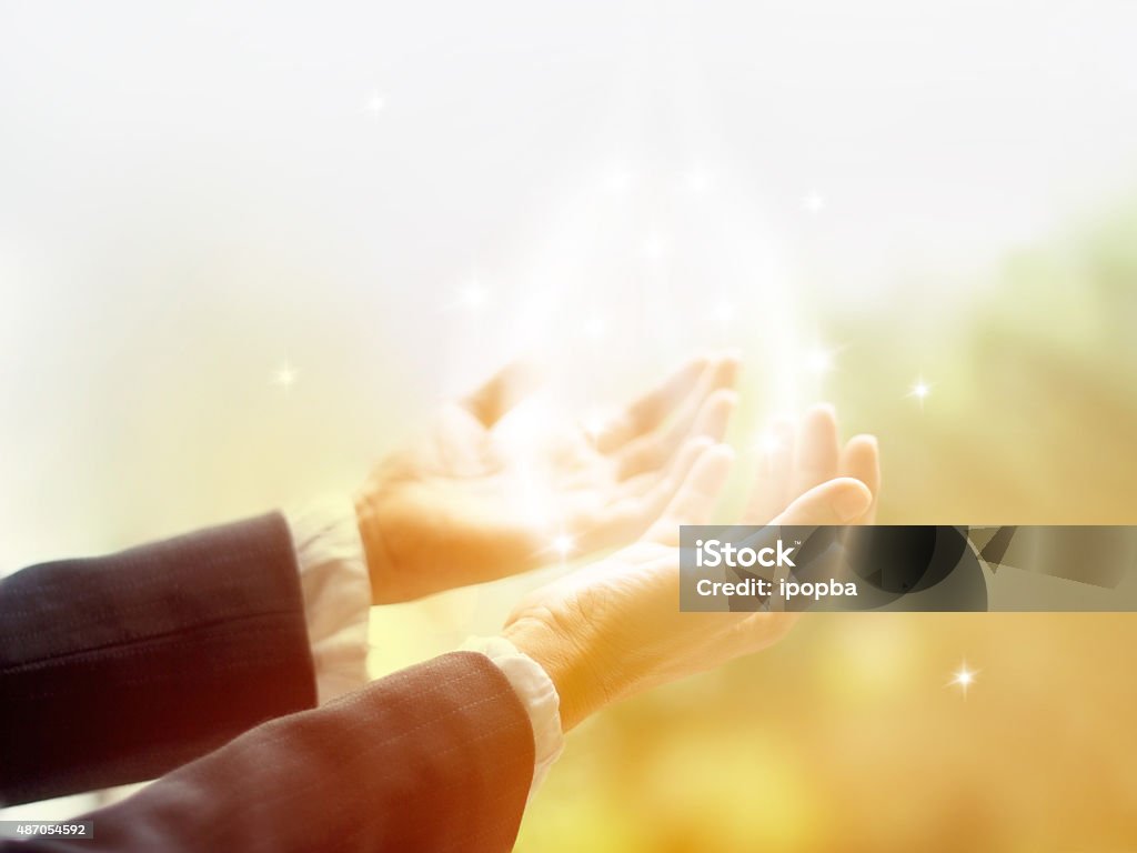 Healing Circle of Light, Old female healer with hands open Healing Circle of Light, Old female healer with hands open up surrounded by a white circle of color and white star light Recovery Stock Photo