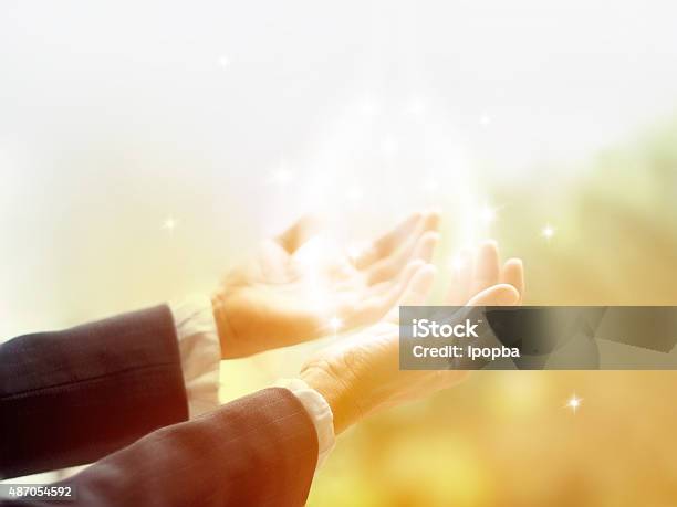 Healing Circle Of Light Old Female Healer With Hands Open Stock Photo - Download Image Now