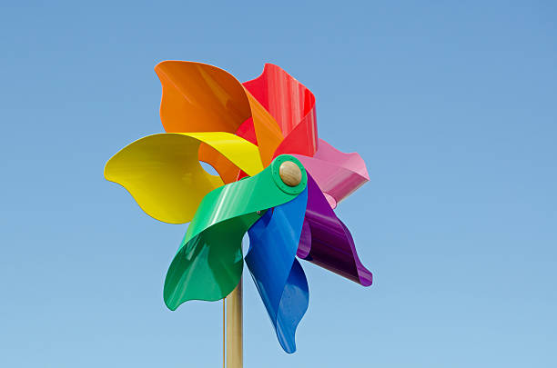 istock Colourful Pinwheel against blue sky 487062796