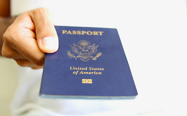 istock Hand Holding an American Passport Isolated 487062810