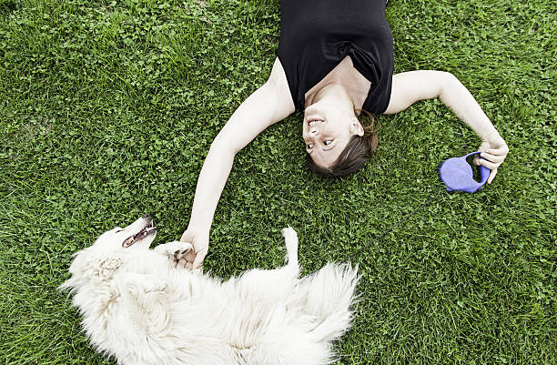 istock Woman smiling dog 487063272