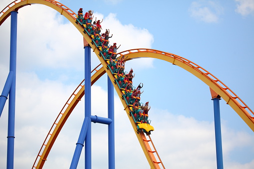 Vaughan, Ontario, Canada - July 11, 2015: People riding the Behemoth rollercoaster at Canada's Wonderland amusement park