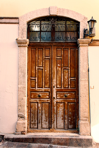 Wooden door in the old town of Italy