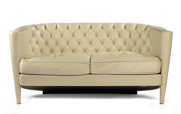 Antique retro sofa couch cream leather isolated on white Unusual retro style antique cream leather sofa  isolated on white leather white hide textured stock pictures, royalty-free photos & images