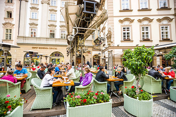 Prague, Czech Republic  - May 3, 2015: People relaxing in Prague cafe in old town