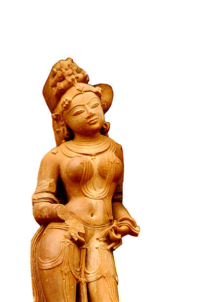 Ancient sculpture of a beautiful Indian girl with white background. Sculpture has been cut out from one of the sculptures at Khajuraho, a UNESCO heritage site. No release is required for this sculpture.