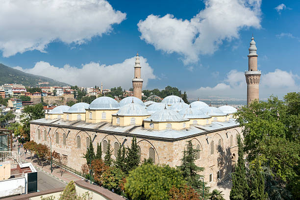 Ulu Cami (Grand Mosque of Bursa), Turkey Bursa, Turkey - August 17,2015: Ulu Cami is a mosque in Bursa, Turkey. Built in the Seljuk style, it was ordered by the Ottoman Sultan Bayezid I and built between 1396 and 1399. The mosque has 20 domes and 2 minarets. grand mosque stock pictures, royalty-free photos & images