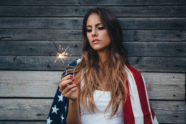 istock Young woman with American flag. 487067780