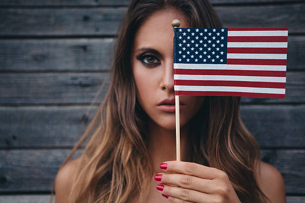 Young woman with American flag.