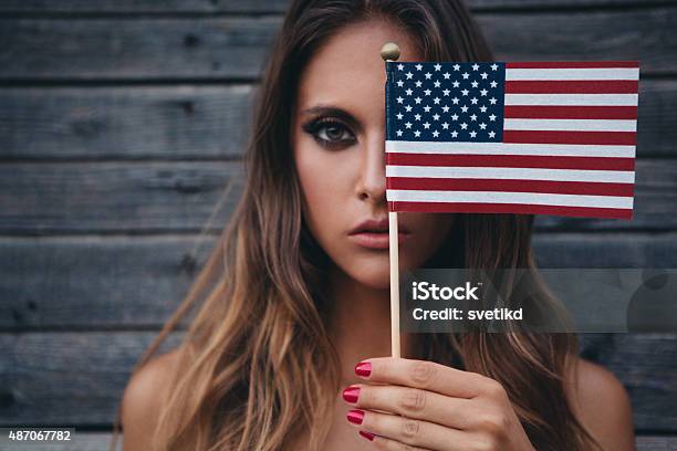 Young Woman With American Flag Stock Photo - Download Image Now - Fourth of July, Beauty, One Woman Only