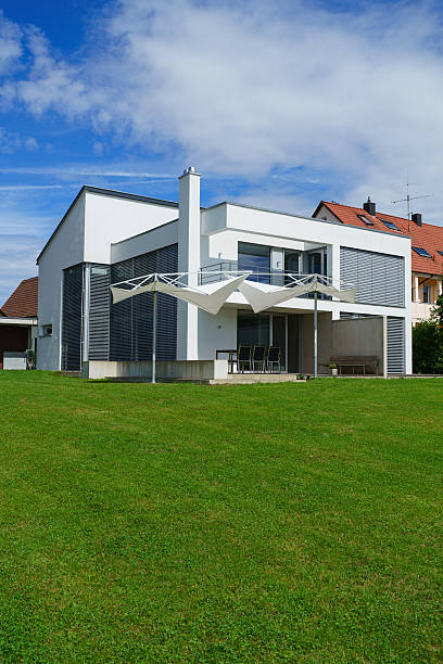 istock Family Home Modern Architecture on Green Summer Meadow 487067908