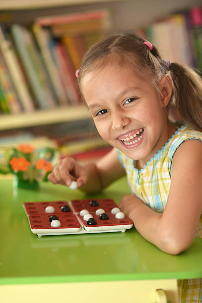 istock Little girl playing at home 487068118