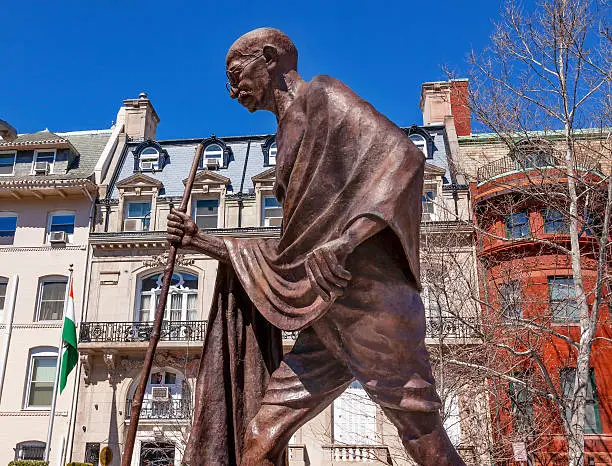 Mahatma Mohandas Gandhi Public Statue Front of Indian Embassy Embassy Row Massachusetts Ave Washington DC.  Gandhi is walking to sea on salt march.  Dedicated September 2000,  Artist Gautam Pal