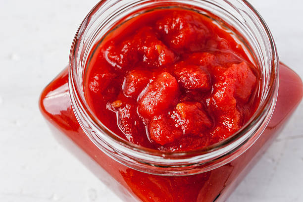 istock Pureed tomatoes in a glass jar 487075150