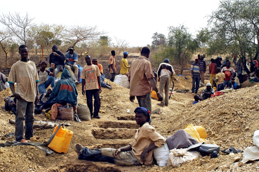 Bologo, Burkina Faso - January 11, 2008: Gold miners are resting after a ranger dug holes to find the vein of gold and the best place to begin the work of extracting the precious metal mine in Burkina Faso Bologo they await the outcome of tests.