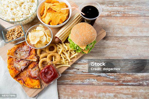 Close Up Of Fast Food Snacks And Drink On Table Stock Photo - Download Image Now - Fast Food, Unhealthy Eating, Fast Food Restaurant