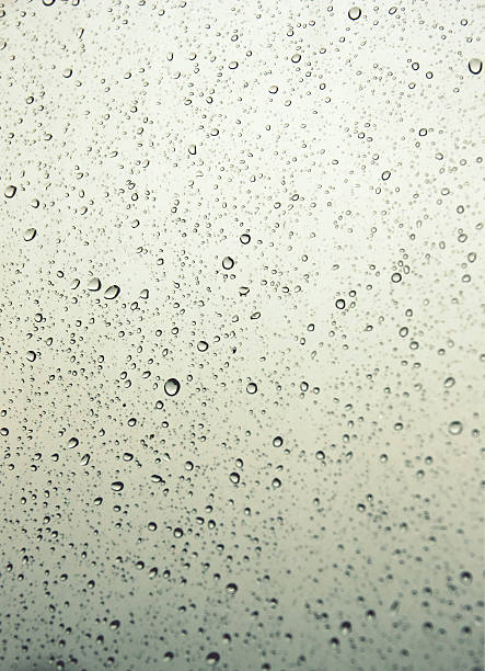 istock Drops of rain on the inclined window 487078256