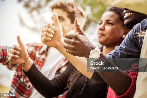 Group Of Teenagers Showing Thumbs Up Stock Photo - Download Image Now - 16-17 Years, 20-29 Years, Achievement