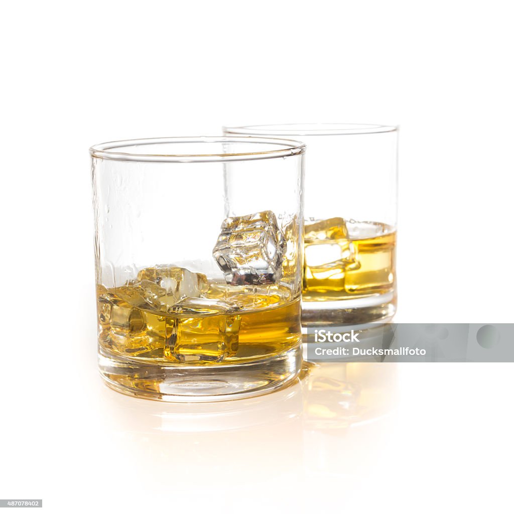 whiskey glasses with ice cubes isolated on white set collage 2015 Stock Photo