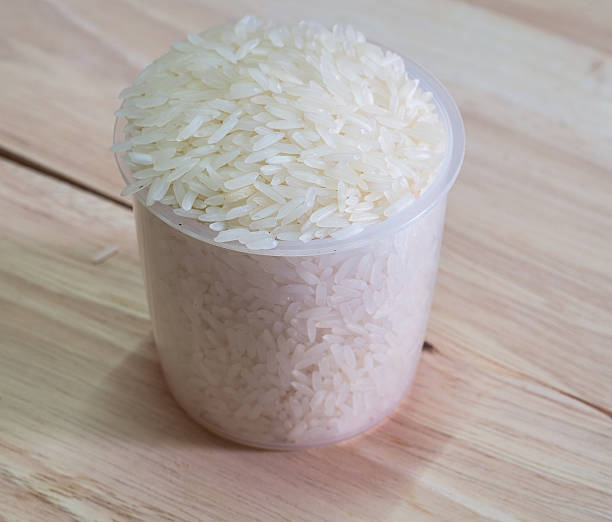istock Jasmin rice on a pile in a cup 487078716