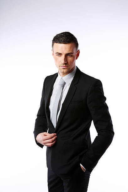 istock Pensive businessman buttoning his jacke 487078875