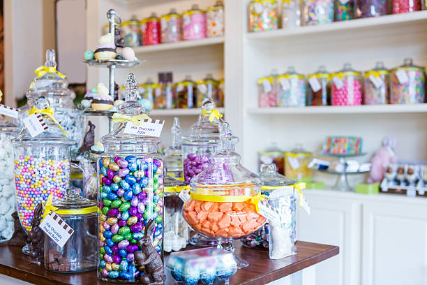 Candy store Jars filled with different candies at the boutique candy store. confectioner photos stock pictures, royalty-free photos & images