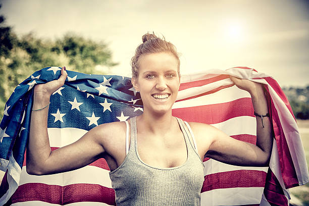 istock Beautiful US athlete with national flag 487080245
